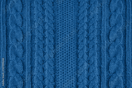 Valokuva Blue knitted wool texture can use as background.Blue trend color