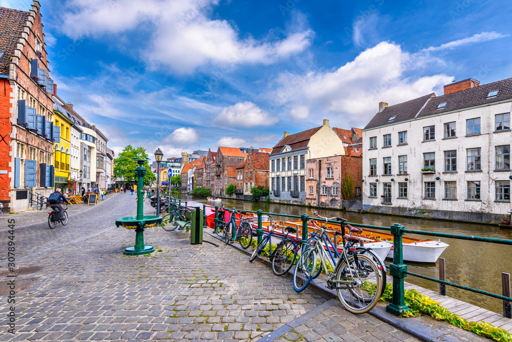 View of embankment of Leie river in the historic city center in Ghent (Gent), Belgium. Architecture and landmark of Ghent. Cityscape of Ghent.