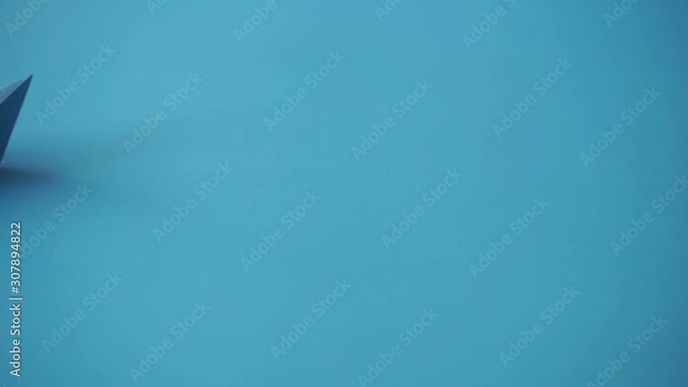 paper boat on clean blue background with copy space, lesson and education concept paper boat on clean blue background with copy space, lesson and education concept