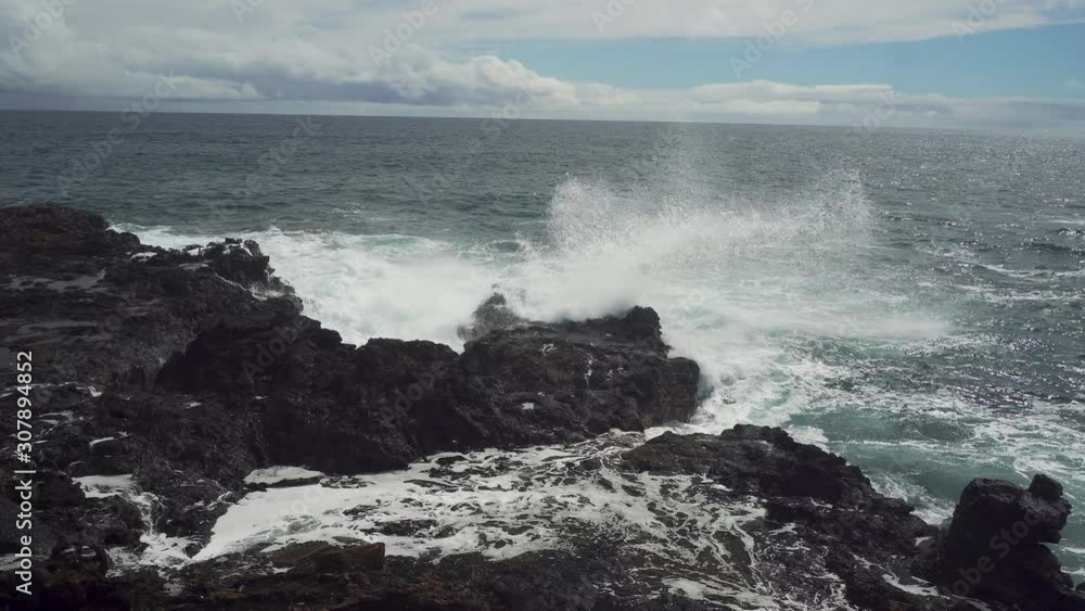 Ocean Waves Bursting onto a Rocky Shoreline Ocean Waves Bursting onto a Rocky Shoreline