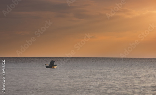Small fisherman boat in the sea.