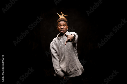Afro american guy with dreadlocks moving aggressively