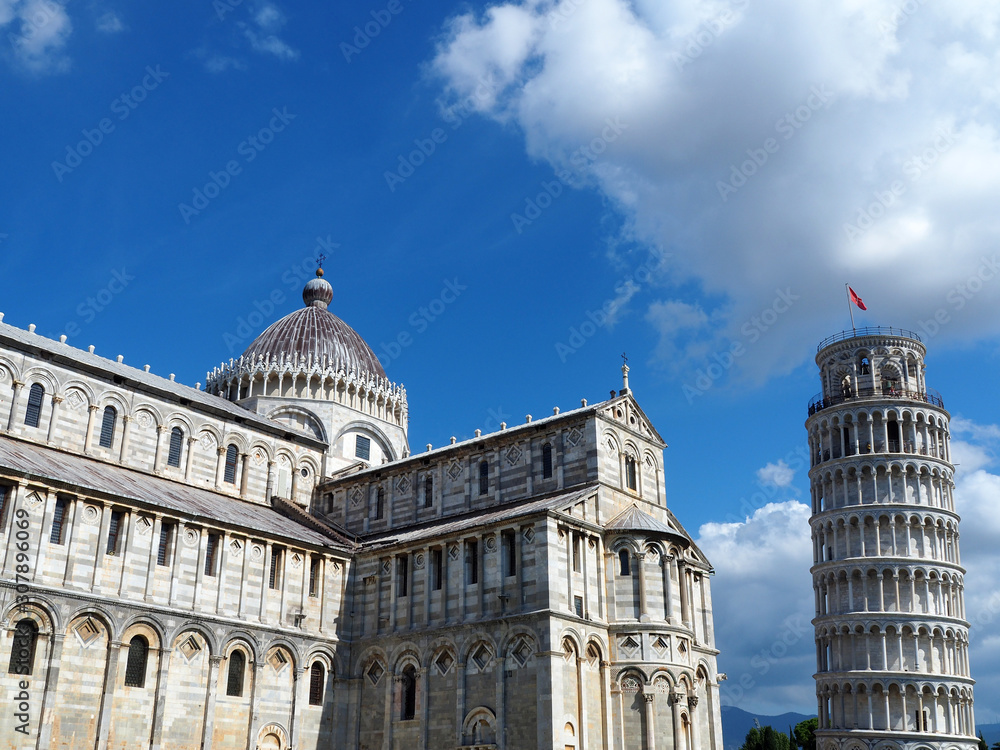 View of the Pisa Cathedral (Duomo di Pisa) and the Leaning Tower of Pisa (Torre pendente di Pisa) in Pisa, Italy. They are located in Miracoli Square (Piazza dei Miracoli).
