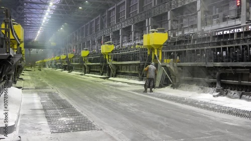 Contemporary large aluminum foundry with casting cells. Electrolytic baths in line in long workshop.