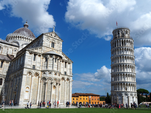 View of the Pisa Cathedral  Duomo di Pisa  and the Leaning Tower of Pisa  Torre pendente di Pisa  in Pisa  Italy. They are located in Miracoli Square  Piazza dei Miracoli .