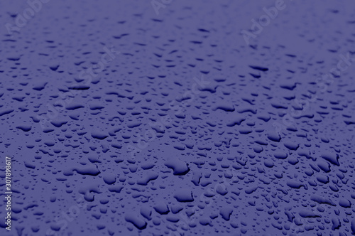 Classic blue color 2020. Texture of water drops on metal. Classic blue background, blue toning 19 4052. Abstract trendy background mock up with copy space for text.