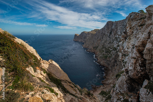 Landscape of the Mediterranean coast with mountains and cliffs with a blue sky from a great height