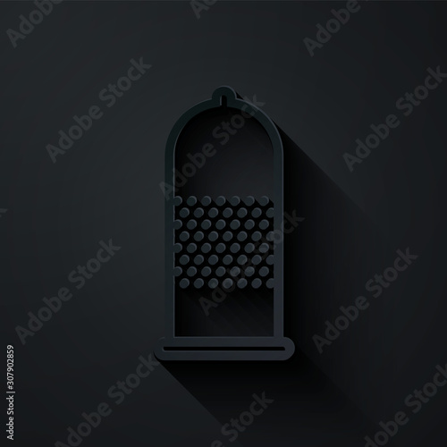 Paper cut Condom safe sex icon isolated on black background. Safe love symbol. Contraceptive method for male. Paper art style. Vector Illustration