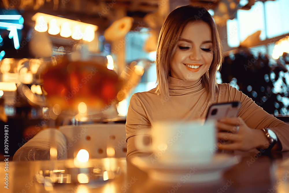 young model drinks tea in a cafe, vacation concept table setting