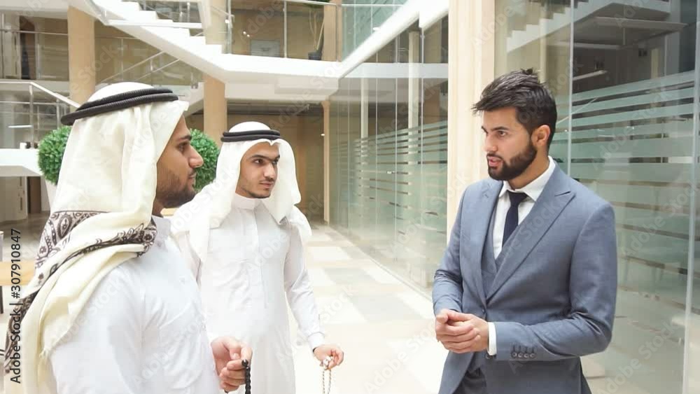 Caucasian going to work with sheikhs, cooperation with sheikhs. Speak about new deal, finance Caucasian going to work with sheikhs, cooperation with sheikhs. Speak about new deal, finance