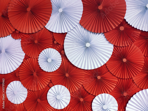 Multicolor Origami  background. Flowers made of paper. Abstract red and white background.