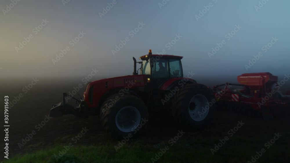 aerial view over the tractor in logs dawn aerial view over the tractor in logs dawn