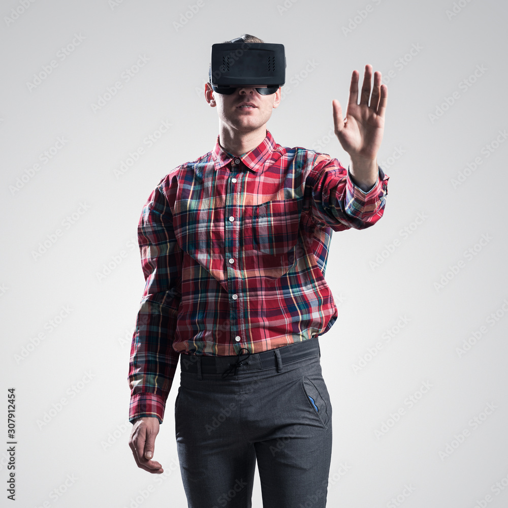 Guy in mask experiencing virtual reality as new entertainment device Guy in mask experiencing virtual reality as new entertainment device