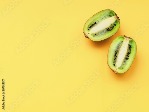  kiwi isolated on YELLOW background. fruits and berries in advertising
