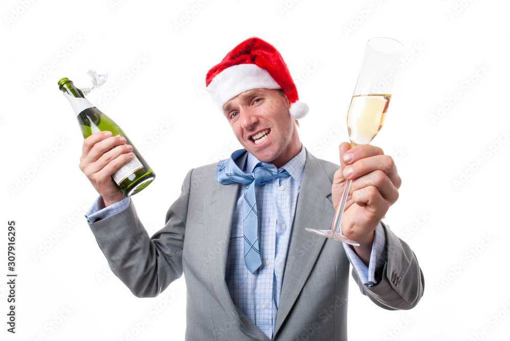 Office worker in disheveled suit and Santa hat holding a bottle and glass of bubbly out in a drunken toast at the holiday party Office worker in disheveled suit and Santa hat holding a bottle and glass of bubbly out in a drunken toast at the holiday party