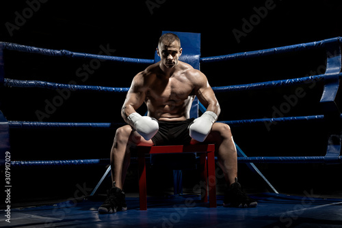 punching boxer on boxing ring