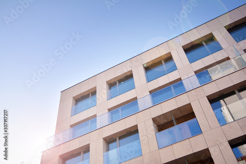 Wallpaper Mural Modern apartment buildings on a sunny day with a blue sky. Facade of a modern apartment building. Glass surface with sunlight. Torontodigital.ca