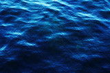 Classic blue color 2020. Texture of sea surface, painted ocean water waves. Classic blue background, blue toning 19 4052. Abstract trendy background mock up with copy space for text.