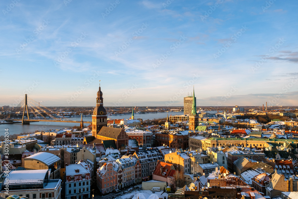 Riga old town panoramic view from St. Peter's Cathedral in winter sunny day.