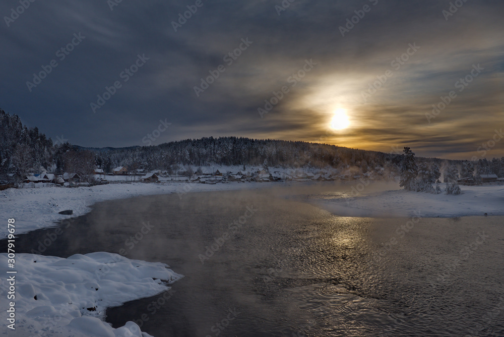 Russia. Mountain Altai, early winter morning in the village of Kebezen on the Bank of the Biya river Russia. Mountain Altai, early winter morning in the village of Kebezen on the Bank of the Biya river