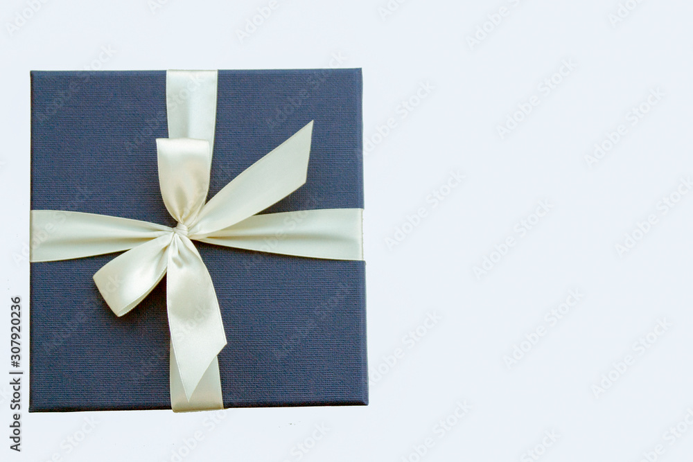 bright gift box with a white ribbon bright gift box with a white ribbon