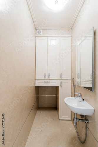 Russia  Omsk- August 02  2019  interior room apartment. standard repair decoration in hostel. bathroom  sink  decoration elements  toilet