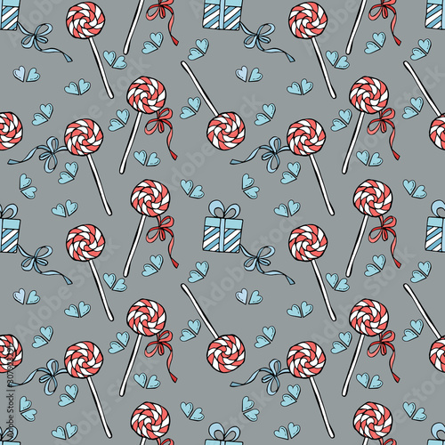 Seamless pattern with gifts and lollipips on gray background. photo