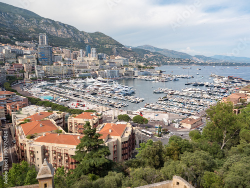 Monaco, july 2019: Panoramic view of port. Azur coast. Colorful bay with a lot of luxury yachts in sunny day © ikmerc