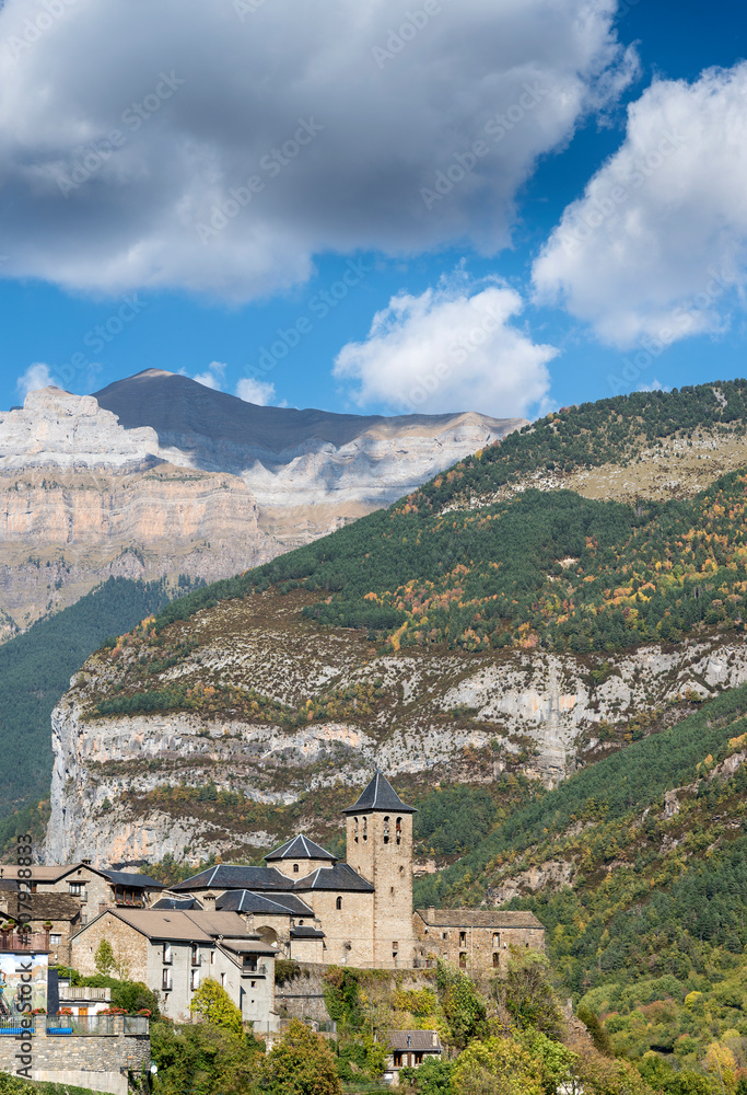 View of the medieval village of Torla, in the Pyrenees of Aragon (Spain) with the national park of Ordesa and Monte Perdido in the background.