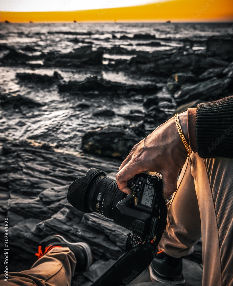 Naklejka premium man with digital camera