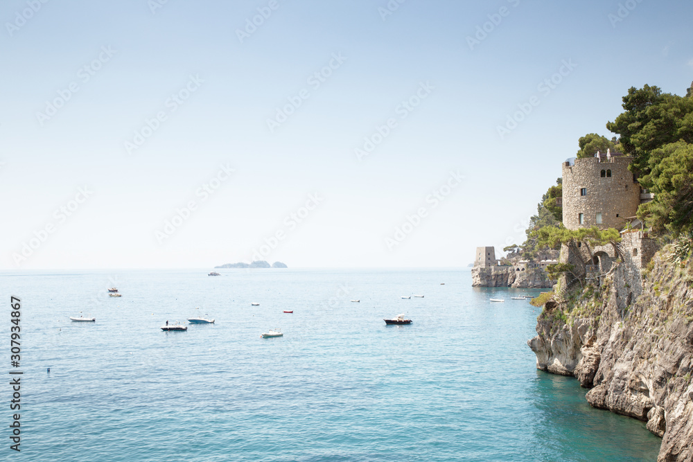 watch tower on the side of a cliff in italy watch tower on the side of a cliff in italy