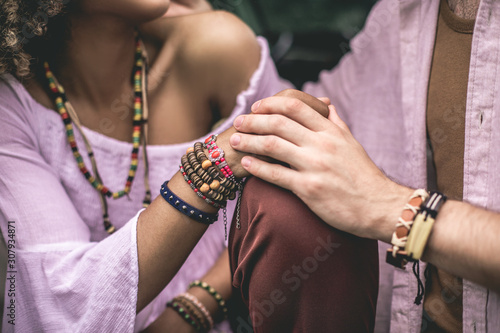 Close up hipster lover man and woman holding hands