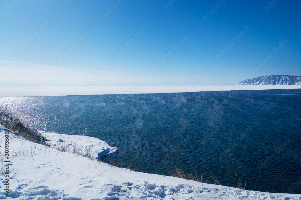 the Angara River runs out of Baikal in winter
