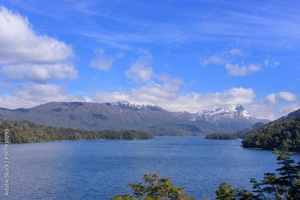 Scenic view of Nahuel Huapi Lake against snow-capped Andes range in Nahuel Huapi National Park, Villa La Angostura, Patagonia, Argentina