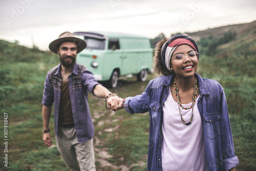 Fotografie Happy stylish man and woman walking together