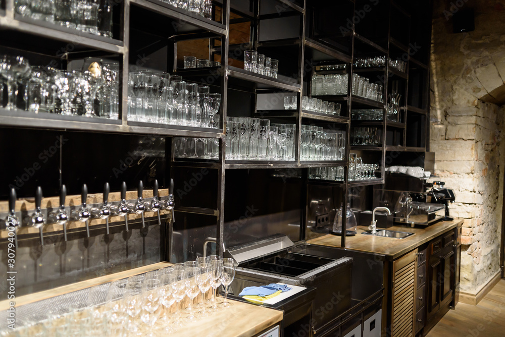 Wine and beer glass shelves in a restaurant or pub