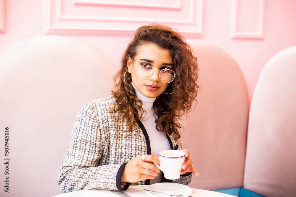 Young woman drinking coffee in the morning at restaurant Young woman drinking coffee in the morning at restaurant