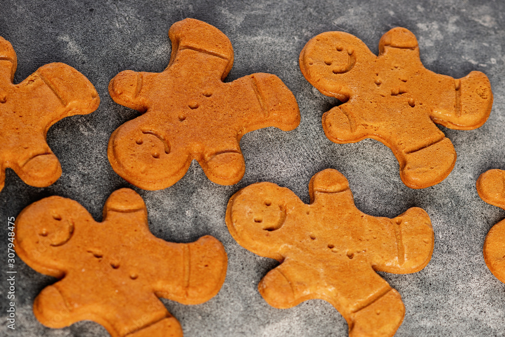 Various christmas gingerbread man cookies on dark table Various christmas gingerbread man cookies on dark table