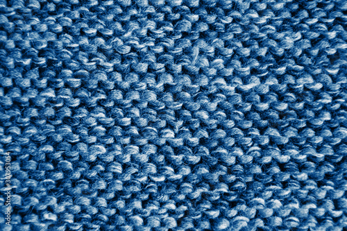 Classic blue knitting wool texture background. Texture in trendy color classic blue.