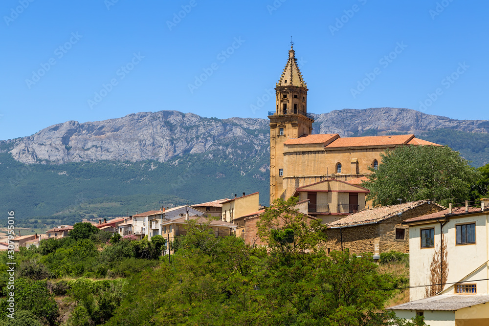 Elvillar, Spain. The picturesque landscape with church on a background of mountains