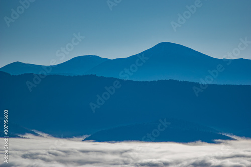 Carpathian mountains in the waves of fog © onyx124