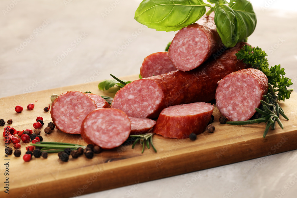 sausage slices, smoked meat product (tasty snack salami) menu concept. food background with cracow sausages
