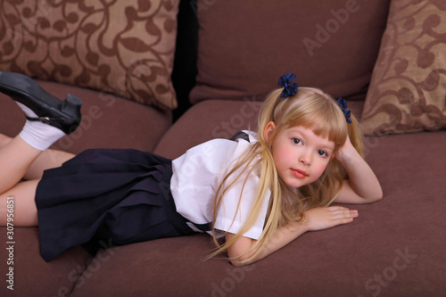 Obraz na plátne Nice cute sweet tender cheerful positive small little girl with curly pony-tails