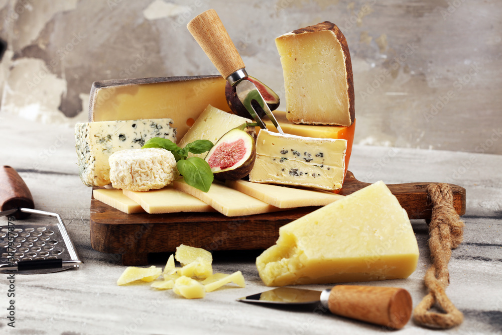 Different sorts of cheese. Cheese platter with different cheese and spice