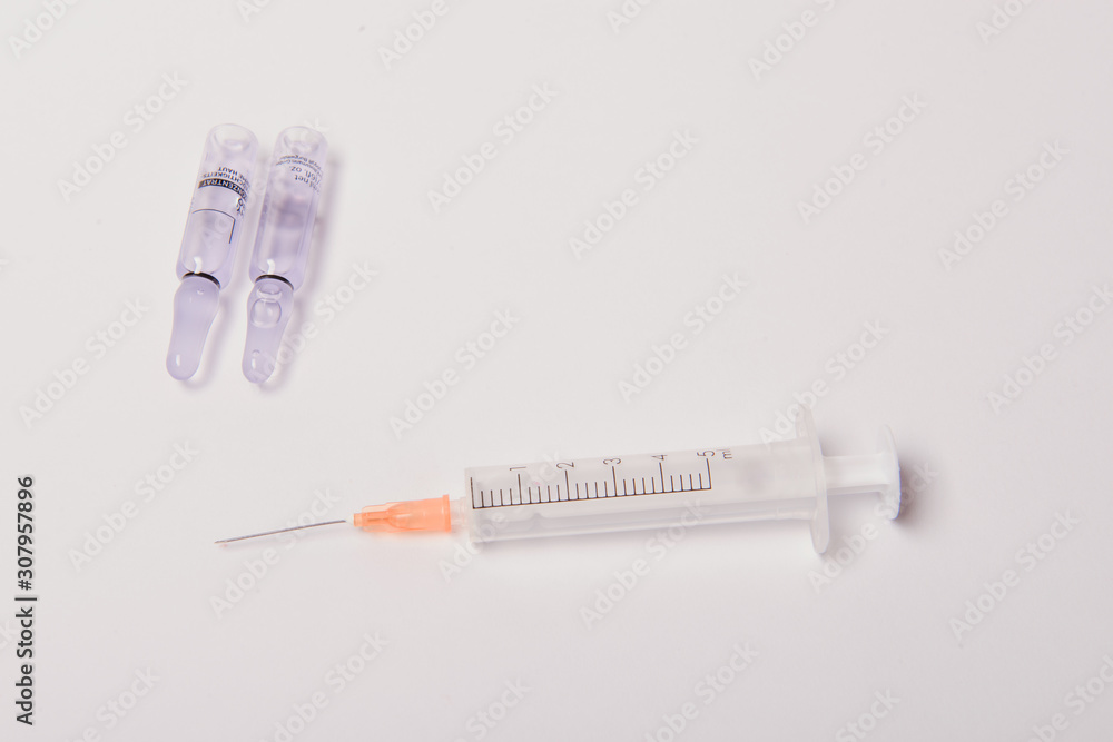 Obraz premium Medical ampules for injections on a white background.