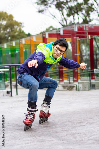 Skater man in the park skating and doing some tricks