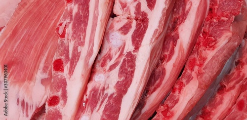 Pork meat on a shop counter close-up, non-vegetarian raw background