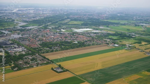 day time amsterdam city aircarft window passenger view aerial panorama 4k netherlands   photo