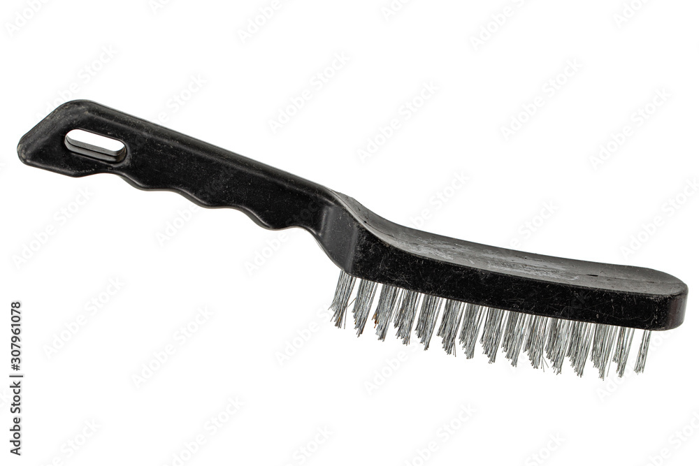 Steel wire brush with handle from black plastic for cleaning and polishing hard or metal equipment, isolated on white background Steel wire brush with handle from black plastic for cleaning and polishing hard or metal equipment, isolated on white background
