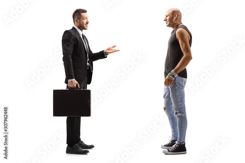 Businessman talking to a male hipster